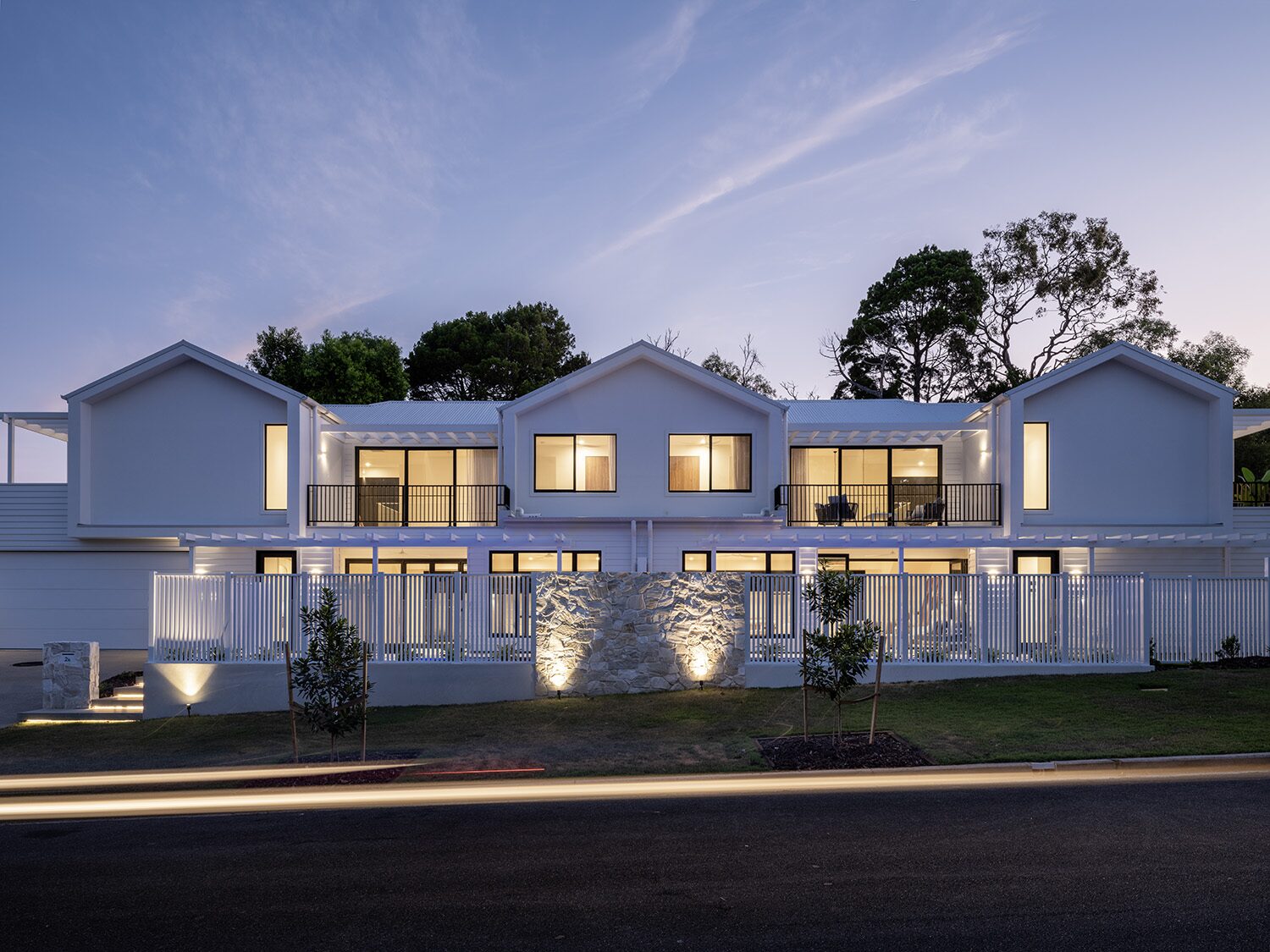 Noosaville, front facade at dusk — designed and built by QLDBuilt