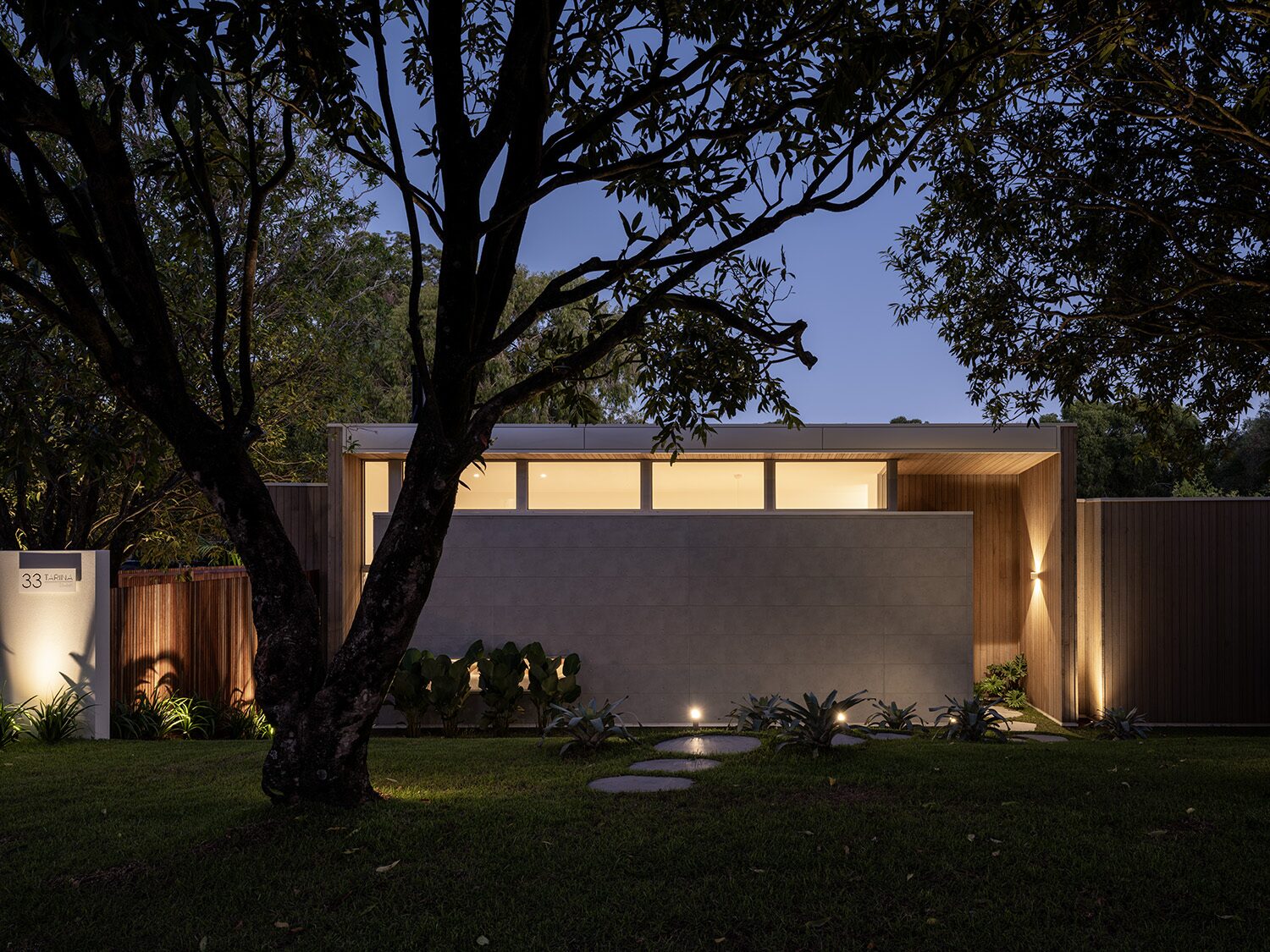 Tarina, front entry at dusk — designed by Hosanna Rodrigues - Studio HR, built by Walt Construction